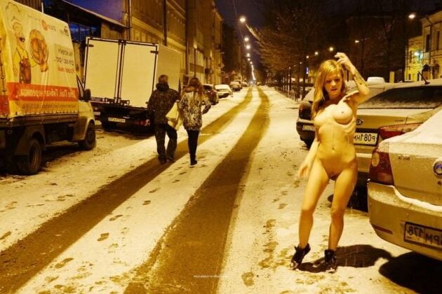 Naked blonde at winter streets