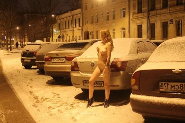 Naked blonde at winter streets