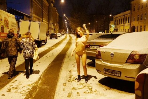 Naked blonde at winter streets