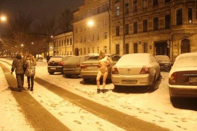 Naked blonde at winter streets