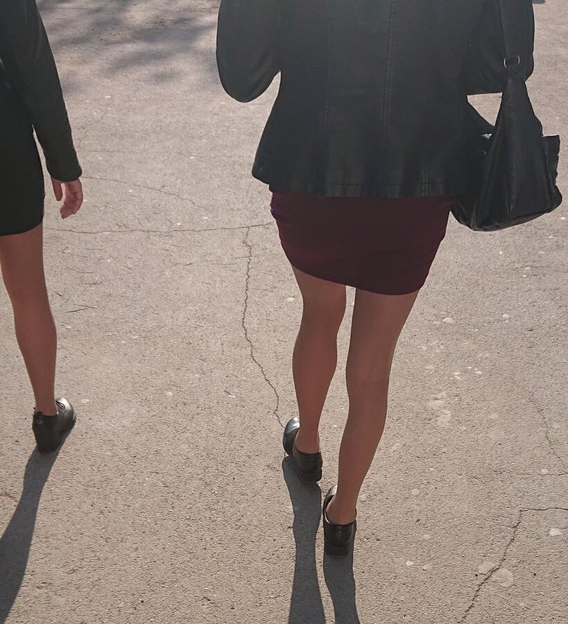 Two whores in pantyhose on the street