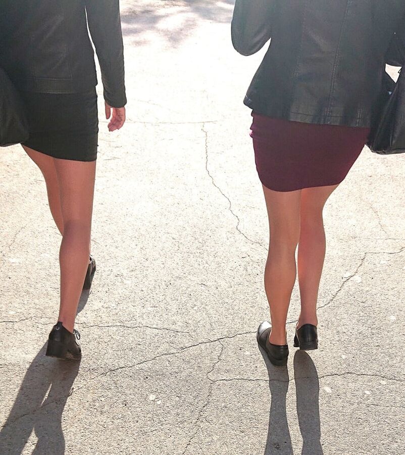 Two whores in pantyhose on the street