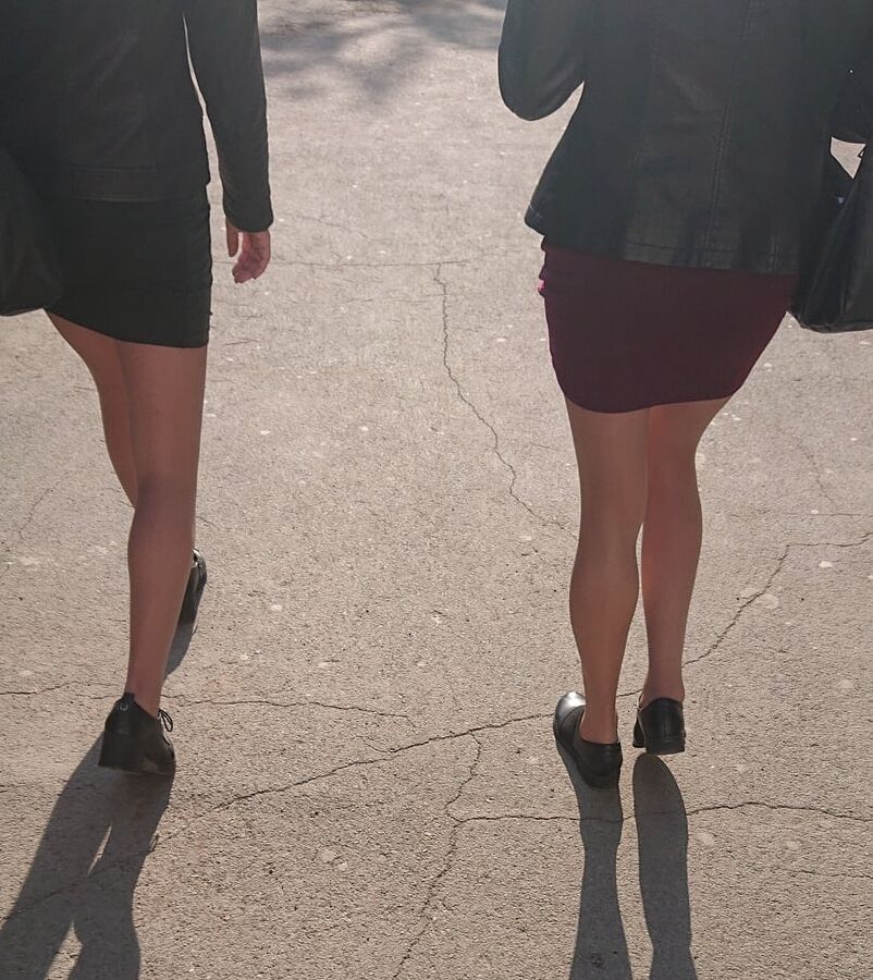 Two whores in pantyhose on the street