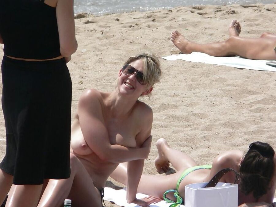 Blond Milf Changing on the Beach for Topless Lovers