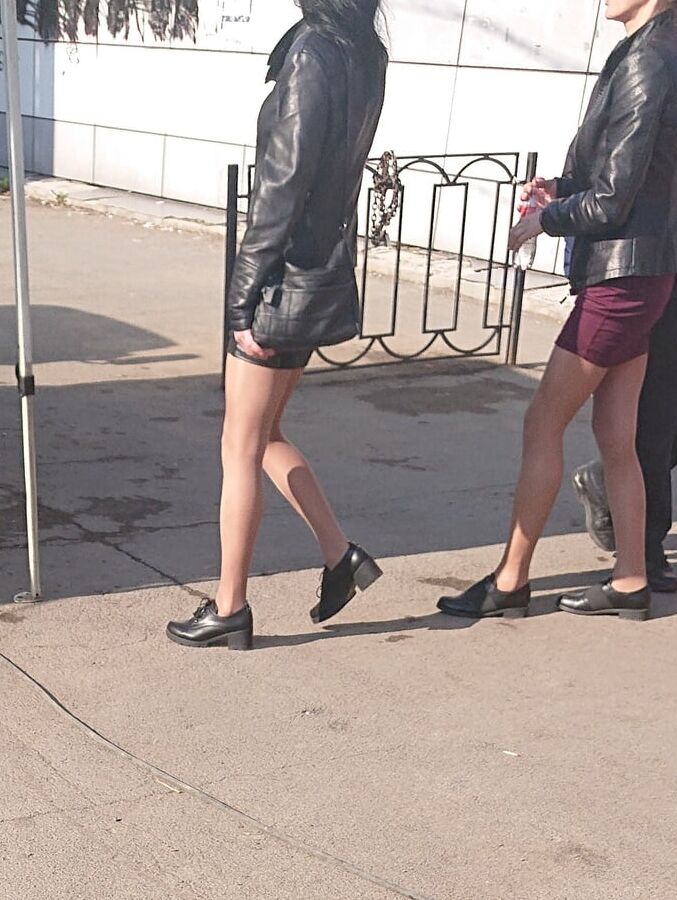 Two whores in pantyhose on the street