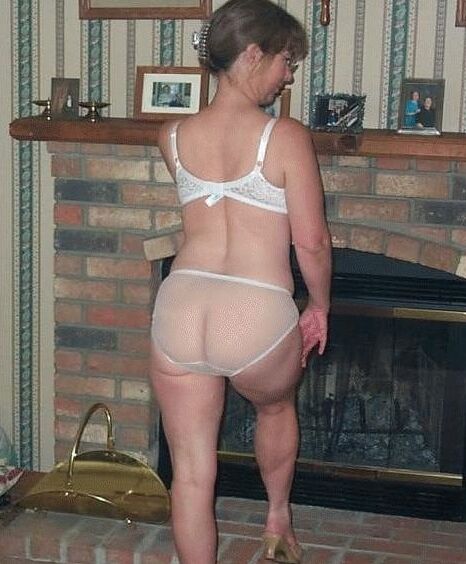 Romantic matures in front of fireplace