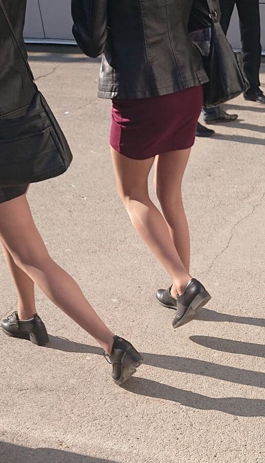 Two whores in pantyhose on the street