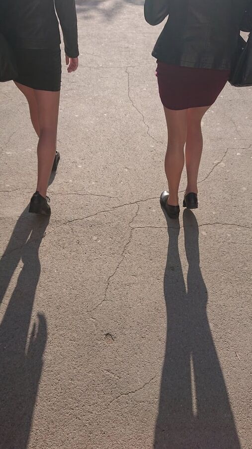 Two whores in pantyhose on the street