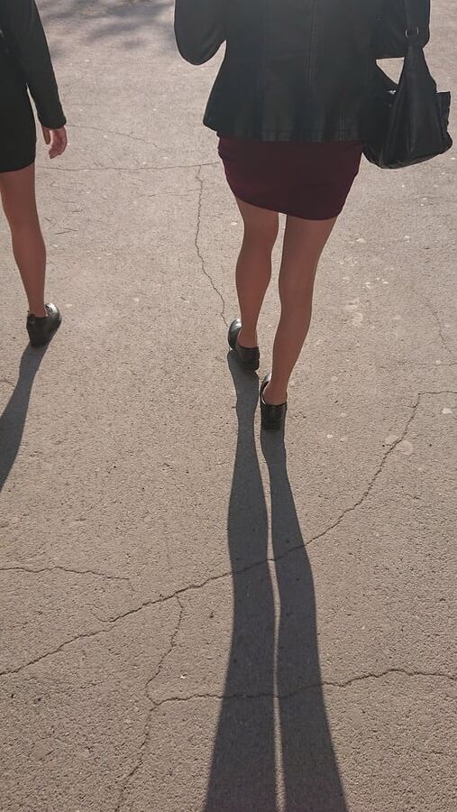 Two whores in pantyhose on the street