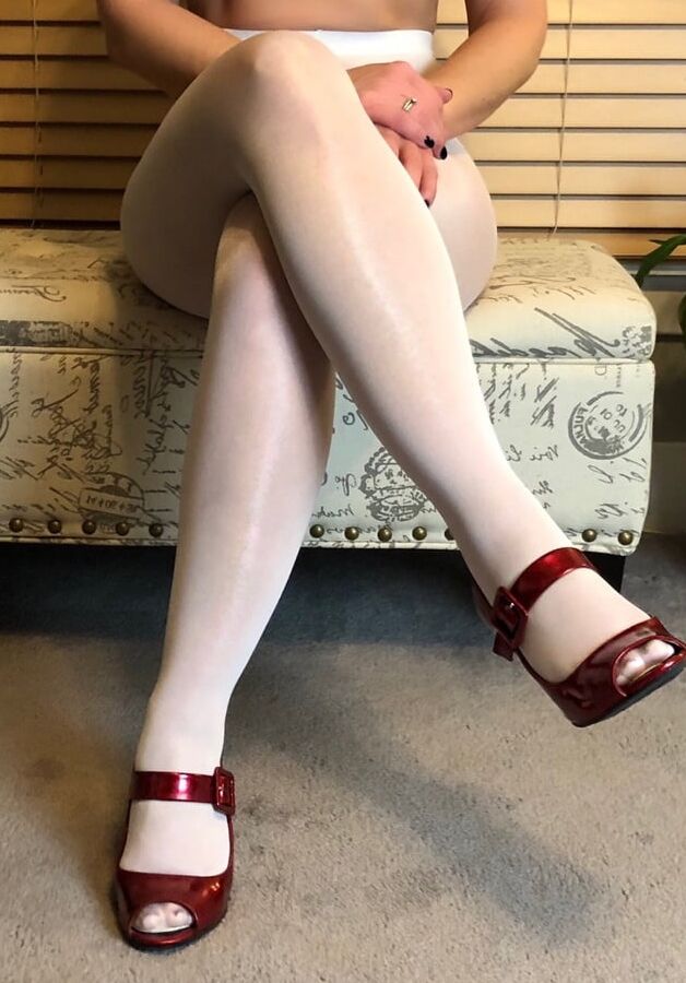 Sexy mature soccer mom showing off her pantyhose and heels