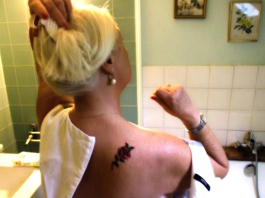 Blonde GILF takes bath