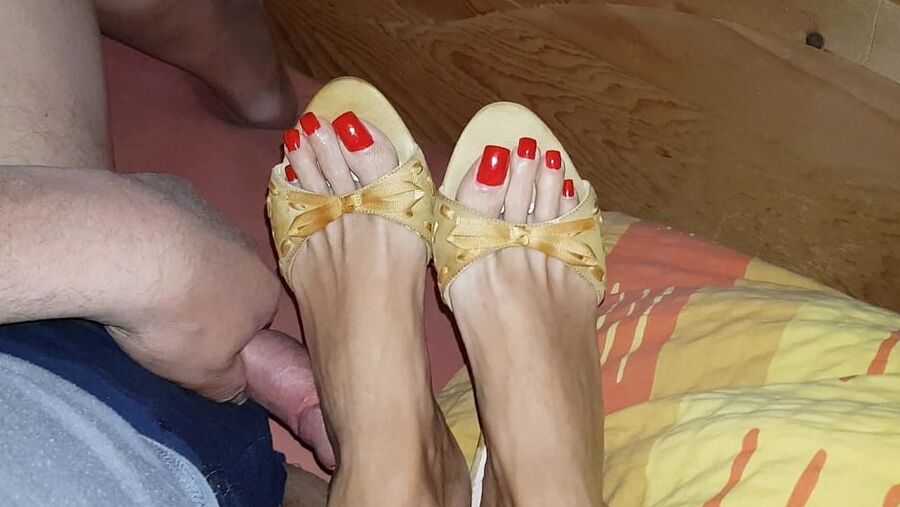 Mules and red toenails