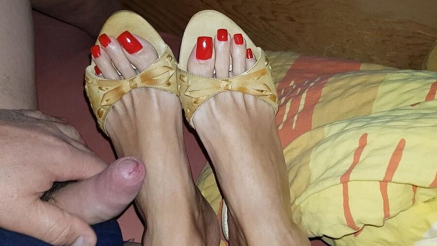 Mules and red toenails