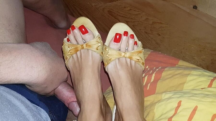 Mules and red toenails