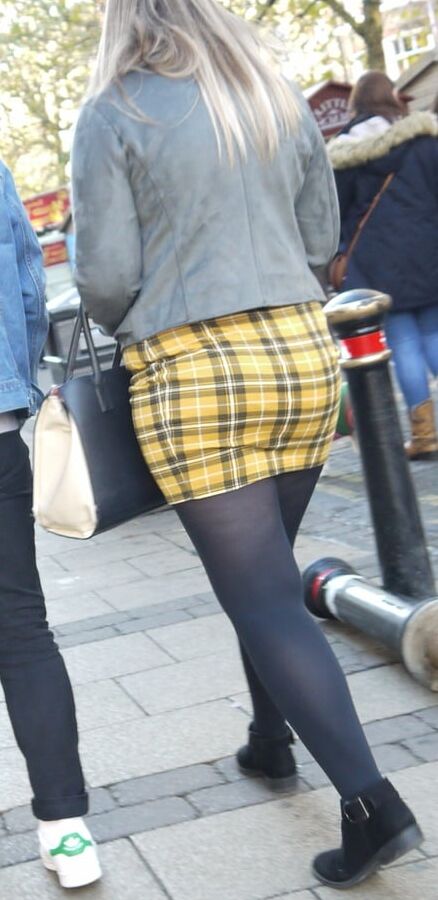 cute blonde in yeloow skirt and black pantyhose