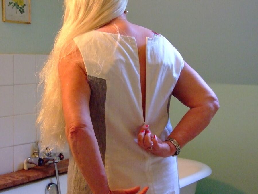 Blonde GILF takes bath