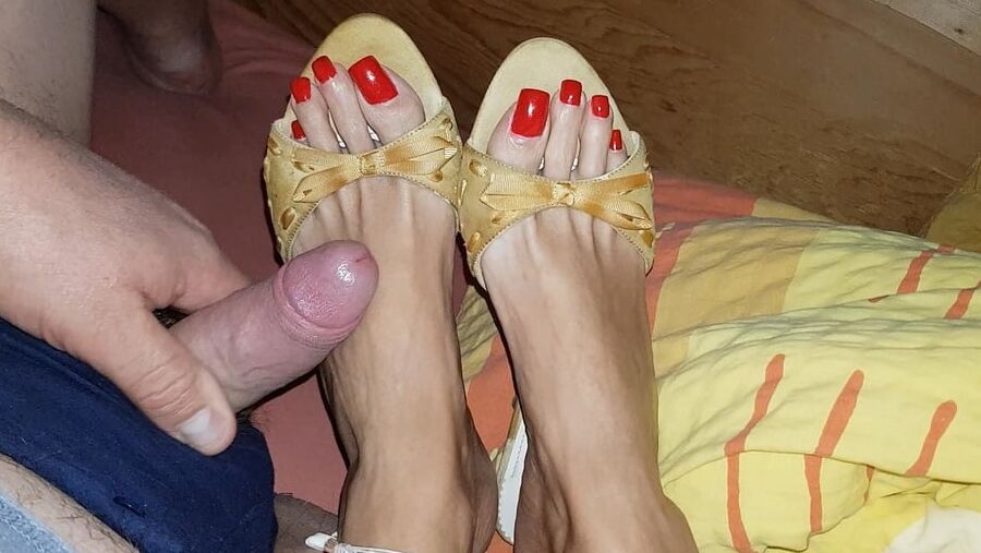 Mules and red toenails
