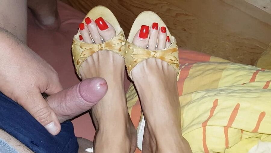 Mules and red toenails