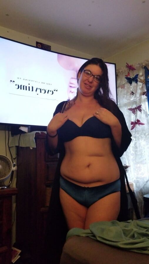 Brunette with glasses shows