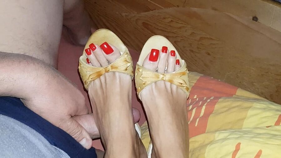 Mules and red toenails