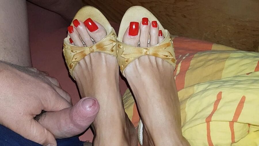 Mules and red toenails
