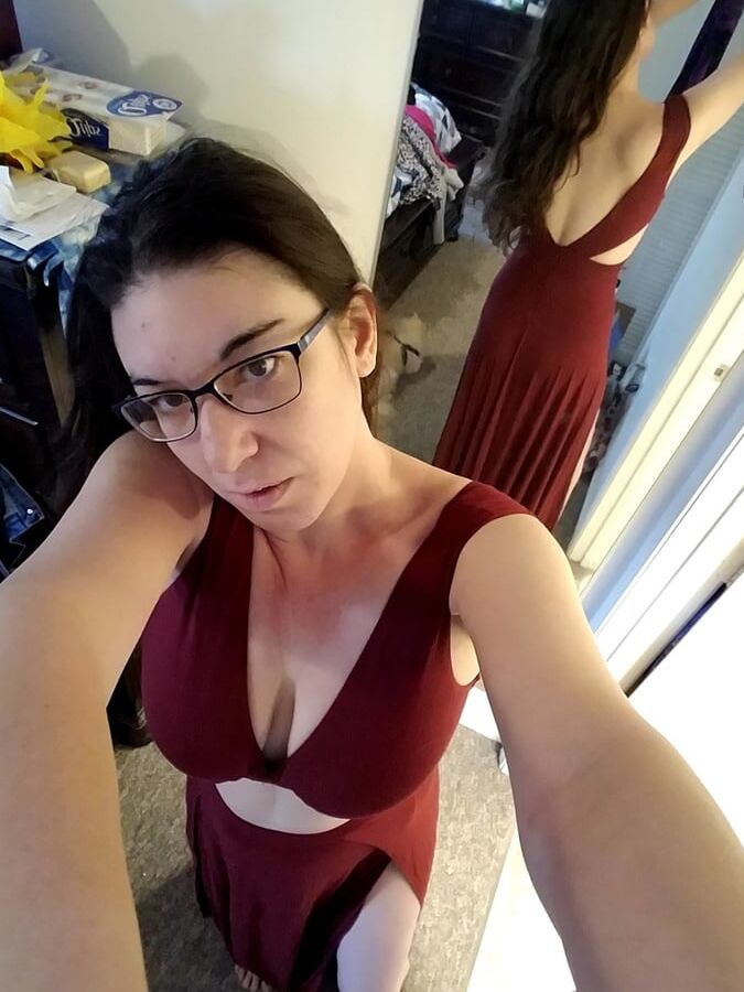 Brunette with glasses shows