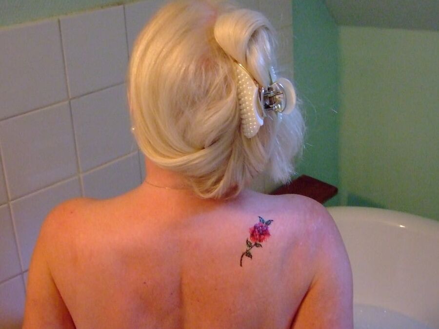 Blonde GILF takes bath