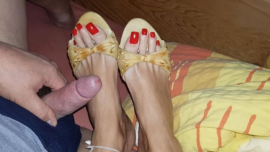 Mules and red toenails