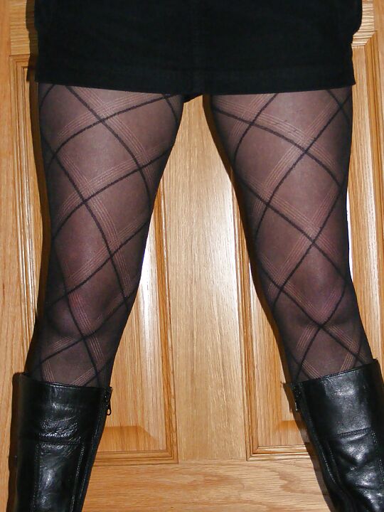 My girlfriend wearing stockings and suspenders