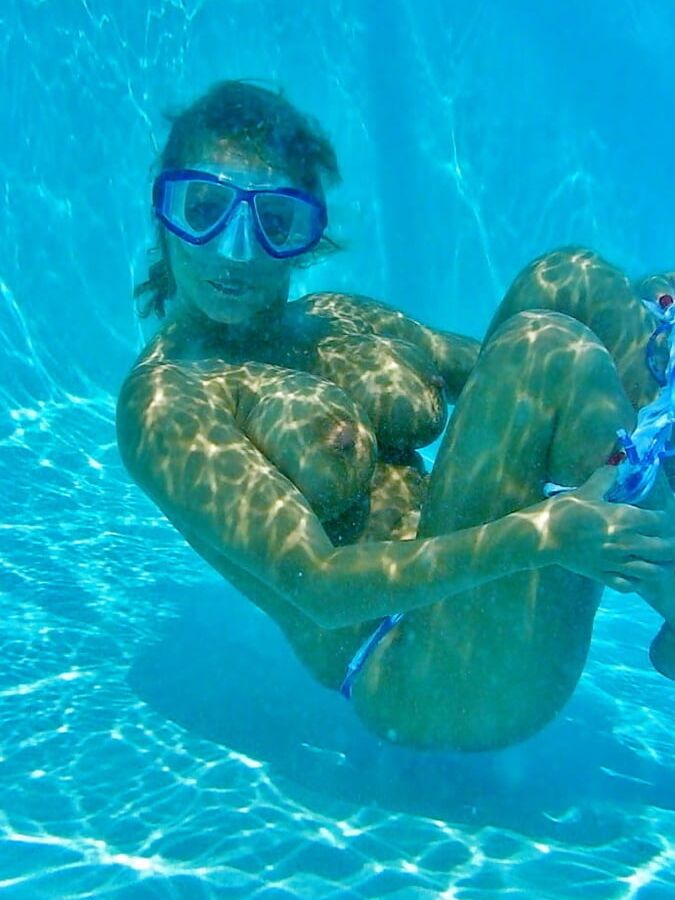 Enjoying her underwater tits