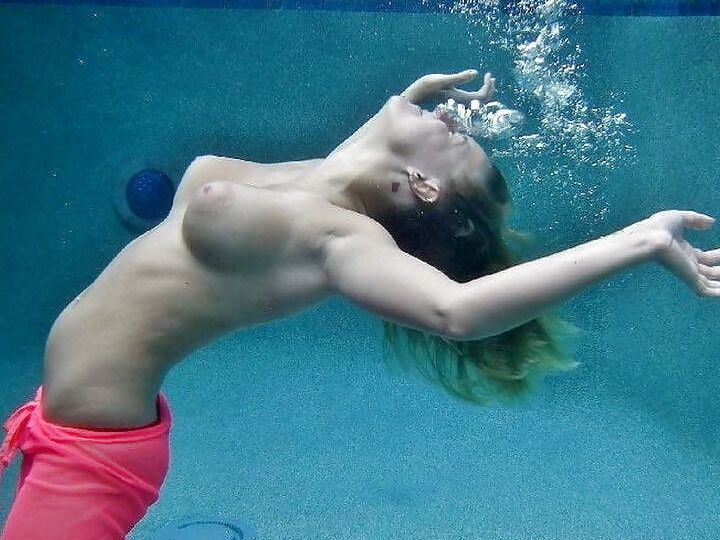 Enjoying her underwater tits