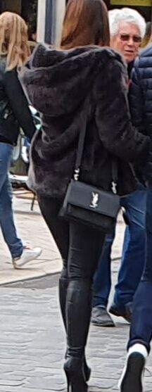 SEXY GIRL IN TIGHT LEATHER SKINNY PANTS AND HIGH HEELS BOOTS