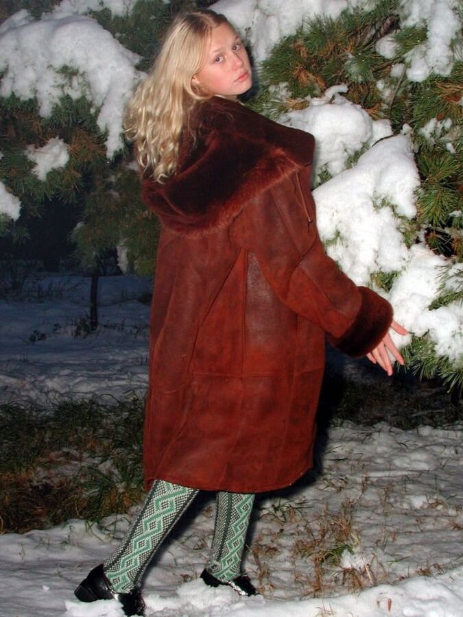 Nice blonde in fur coat posing