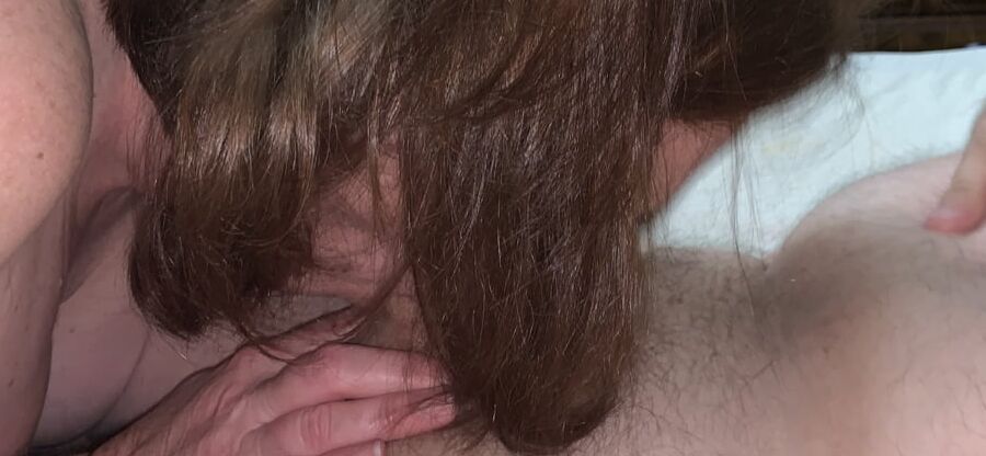 Sucking dick.