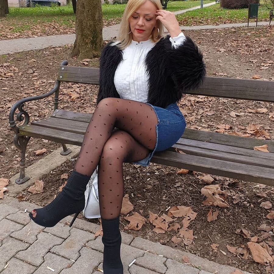 Amateur mature Sonja posing in nylon outside