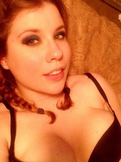 Redhead wife posing