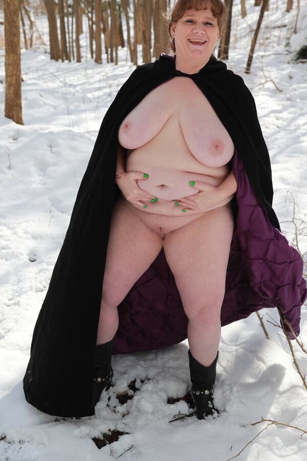 Sally in black cape in winter