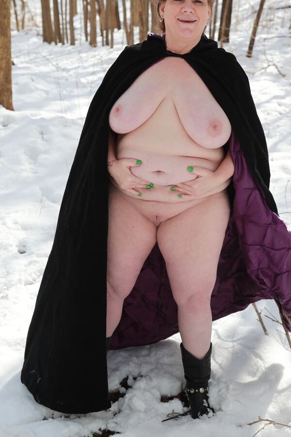 Sally in black cape in winter