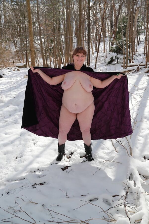Sally in black cape in winter