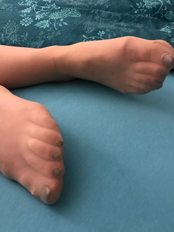 GF shows off stocking legs, feet and ass