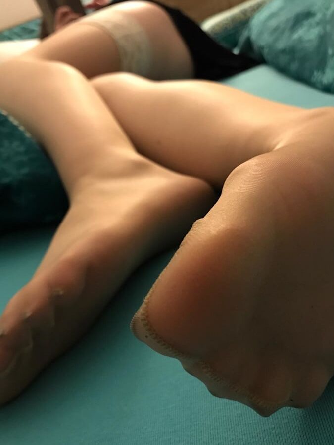 GF shows off stocking legs, feet and ass