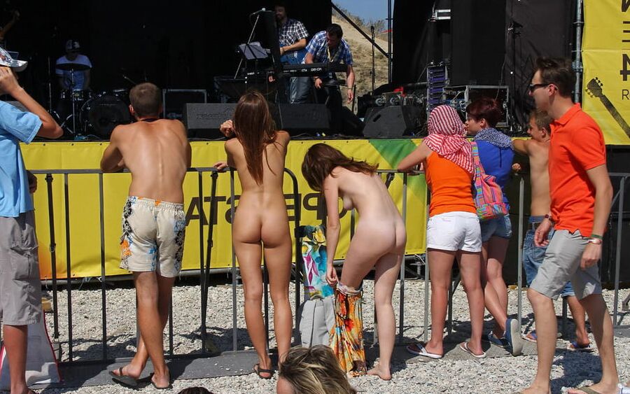 Two shameless girls undress at holidays beach