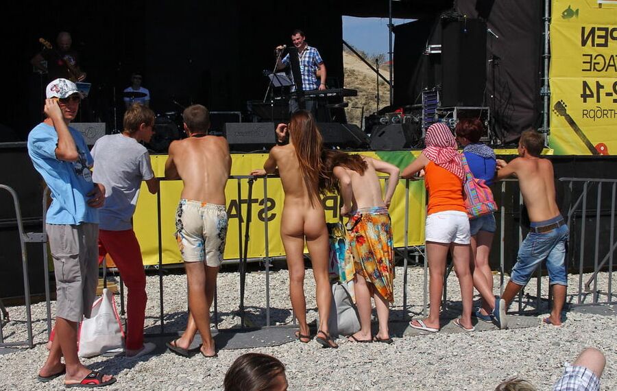 Two shameless girls undress at holidays beach
