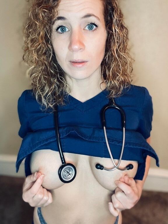 Touching her own nipples