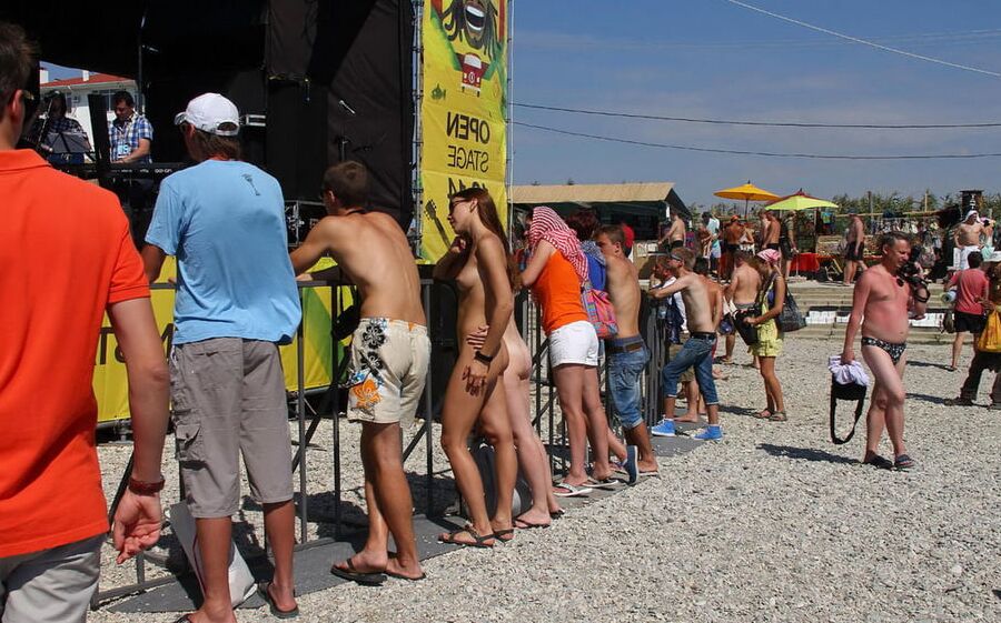 Two shameless girls undress at holidays beach