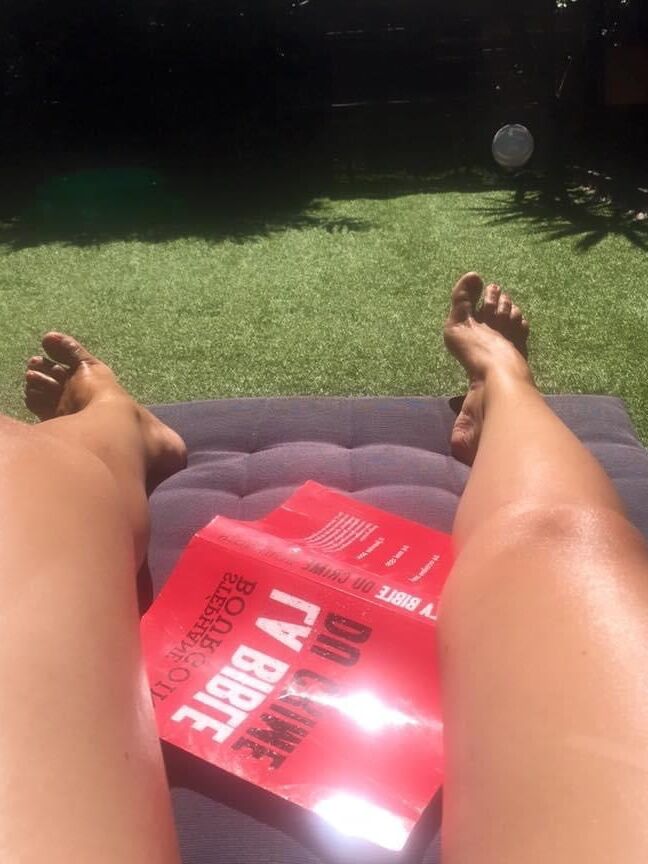 Legs and feet of a pretty reader