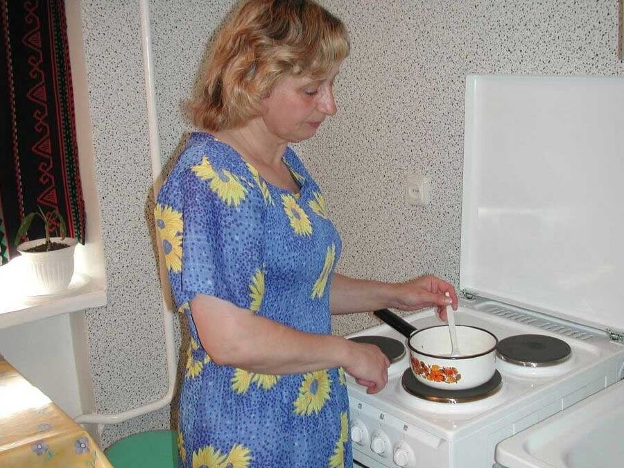 Mature in the kitchen with a junior