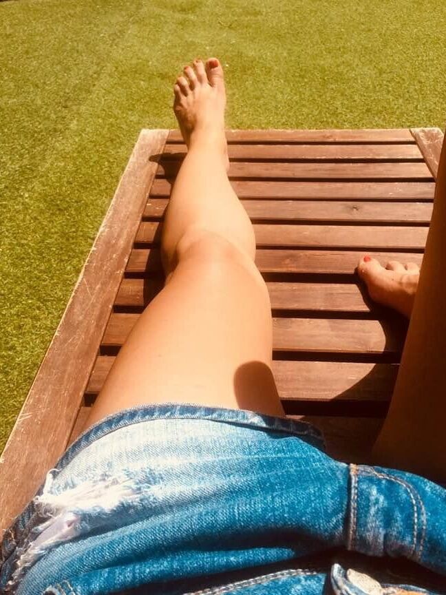 Legs and feet of a pretty reader