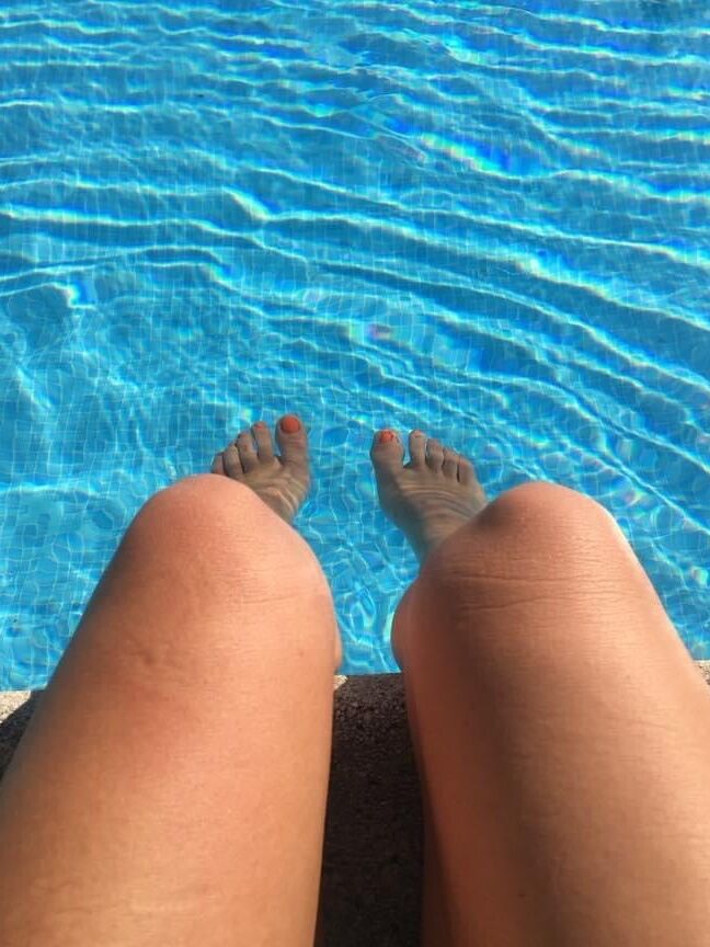 Legs and feet of a pretty reader