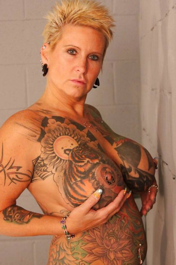 Tattooed mature Janine